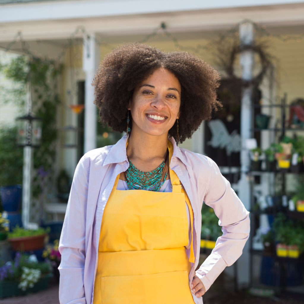 Shopkeeper outside of a small business